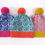 Thumbnail: Geometric patterned knitted hats with pom poms in various colourways