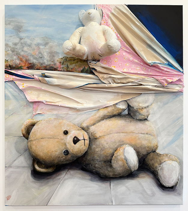 A Teddy bear is lying on the floor. Above it the canvas of the painting is draped and turns into a pink baby blanket that covers a blue/black corner of the canvas. In the middle of the top part is an actual 3D Teddy Bear that is painted over mostly in white. On the left side next to it and on the other corner there is a depiction of a fire and bellowing smoke in a rural area.
This painting, part of a series exploring the human experience amidst upheaval. The horizon hints at a subtle underlying turmoil. The torn/draped canvas serves as a symbolic rupture in the peaceful facade, suggesting an unseen catastrophe that disrupts the calmness.