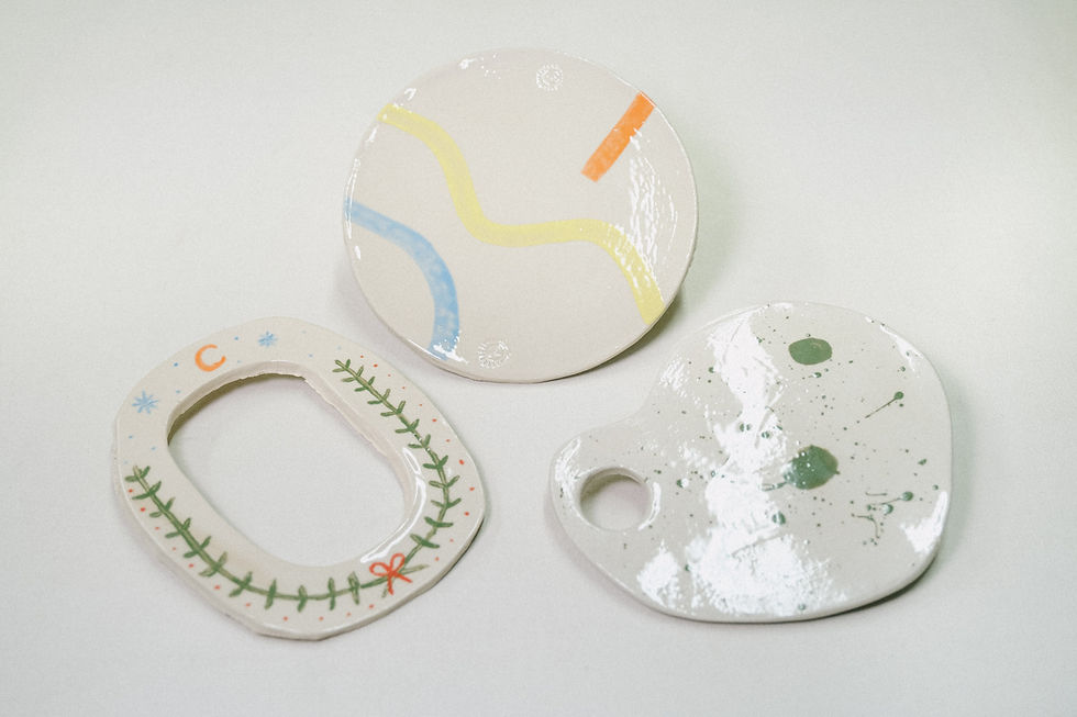 Three handcrafted objects in painted ceramic.