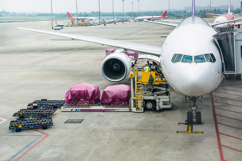 Loading cargo on the plane in airport, view through window.jpg