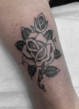 Forearm Arm Rose American Traditional Tattoo Trad Tattoo Black and Grey by Erik Jeffrey. Death Proof Tattoo and Barber. Whistler, BC. Pemberton, Squamish, Vancouver Canada. Tattoo Studio. Tattoo Shop. Barber Shop. Tattoo Artist. Professional Services.