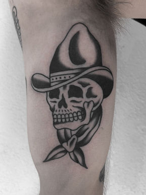 Cowboy Skull American Traditional Tattoo Trad Tattoo Black and Grey by Erik Jeffrey. Death Proof Tattoo and Barber. Whistler, BC. Pemberton, Squamish, Vancouver Canada. Tattoo Studio. Tattoo Shop. Barber Shop. Tattoo Artist. Professional Services.
