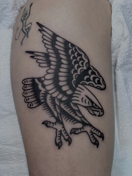 Bald Eagle American Traditional Tattoo Trad Tattoo Black and Grey by Erik Jeffrey. Death Proof Tattoo and Barber. Whistler, BC. Pemberton, Squamish, Vancouver Canada. Tattoo Studio. Tattoo Shop. Barber Shop. Tattoo Artist. Professional Services.