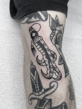 Lucky Foot American Traditional Tattoo Trad Tattoo Black and Grey by Erik Jeffrey. Death Proof Tattoo and Barber. Whistler, BC. Pemberton, Squamish, Vancouver Canada. Tattoo Studio. Tattoo Shop. Barber Shop. Tattoo Artist. Professional Services.