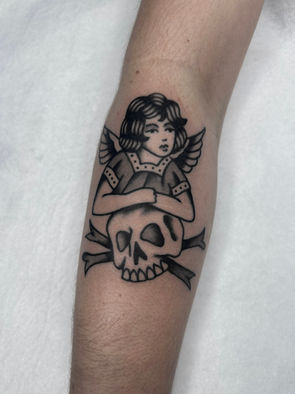 Skull Crossbones Lady Woman Girl Angel American Traditional Tattoo Trad Tattoo Black and Grey by Erik Jeffrey. Death Proof Tattoo and Barber. Whistler, BC. Pemberton, Squamish, Vancouver Canada. Tattoo Studio. Tattoo Shop. Barber Shop. Tattoo Artist. Professional Services.