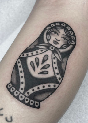 Russian Nesting Doll American Traditional Tattoo Trad Tattoo Black and Grey by Erik Jeffrey. Death Proof Tattoo and Barber. Whistler, BC. Pemberton, Squamish, Vancouver Canada. Tattoo Studio. Tattoo Shop. Barber Shop. Tattoo Artist. Professional Services.
