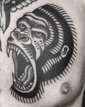 Gorilla American Traditional Tattoo Trad Tattoo Black and Grey by Erik Jeffrey. Death Proof Tattoo and Barber.  Whistler, BC. Pemberton, Squamish, Vancouver Canada. Tattoo Studio. Tattoo Shop. Barber Shop. Tattoo Artist. Professional Services.  