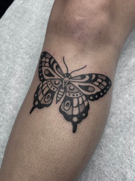 Butterfly American Traditional Tattoo Trad Tattoo Black and Grey by Erik Jeffrey. Death Proof Tattoo and Barber. Whistler, BC. Pemberton, Squamish, Vancouver Canada. Tattoo Studio. Tattoo Shop. Barber Shop. Tattoo Artist. Professional Services.