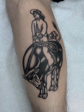 Cowboy Bull Rodeo American Traditional Tattoo Trad Tattoo Black and Grey by Erik Jeffrey. Death Proof Tattoo and Barber. Whistler, BC. Pemberton, Squamish, Vancouver Canada. Tattoo Studio. Tattoo Shop. Barber Shop. Tattoo Artist. Professional Services.