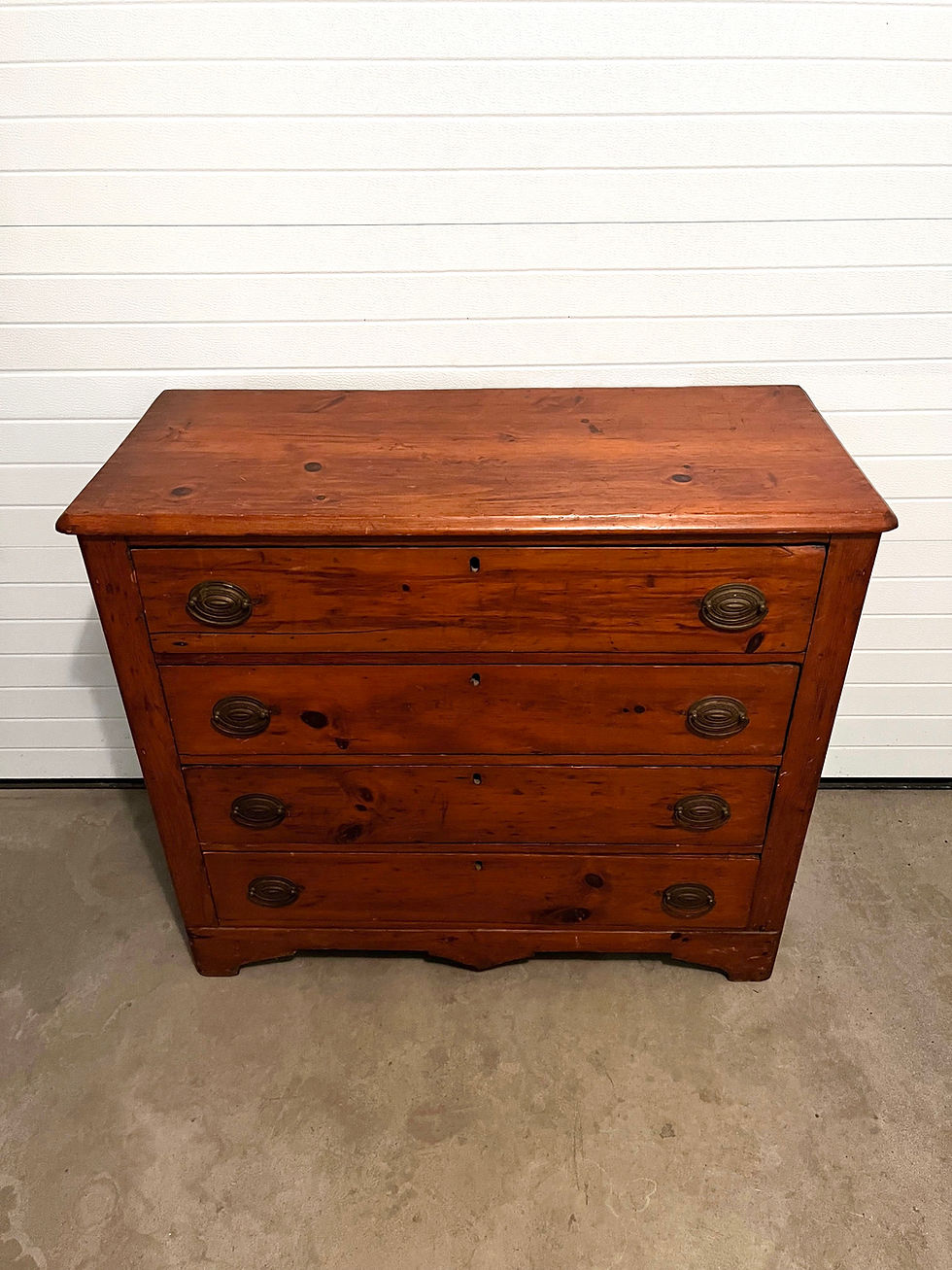 Thumbnail: Antique Stained Pine Four Drawer Chest with Decorative Metal Drawer Handles