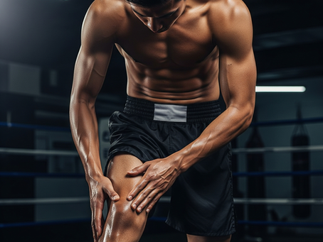 Athlete massaging muscles with oil, highlighting recovery and preparation for martial arts training.