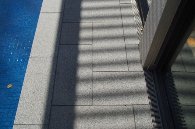 Silver granite poolside paving