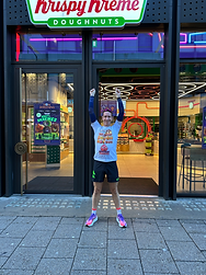 man wearing orange cancer charity top standing on a treadmill