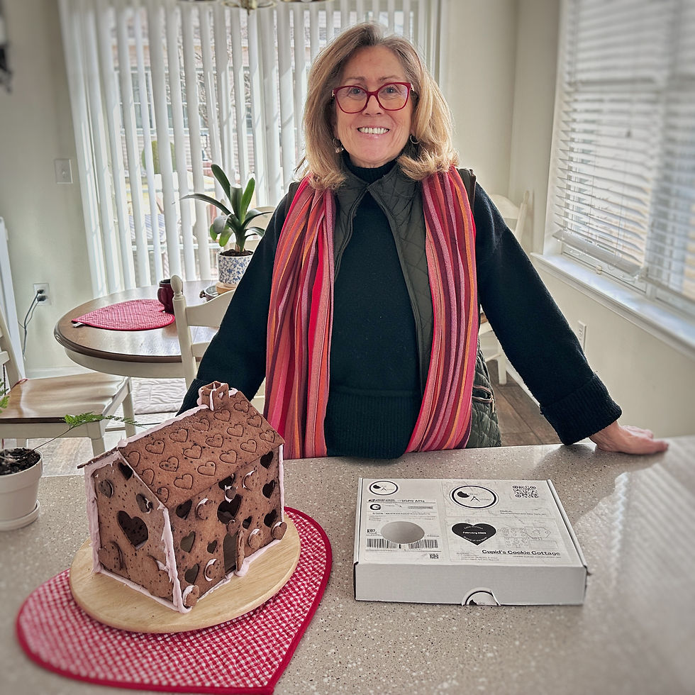 Mom with a completed Cupid's Cookie Cottage, made with Edible Architect cookie cutter construction set