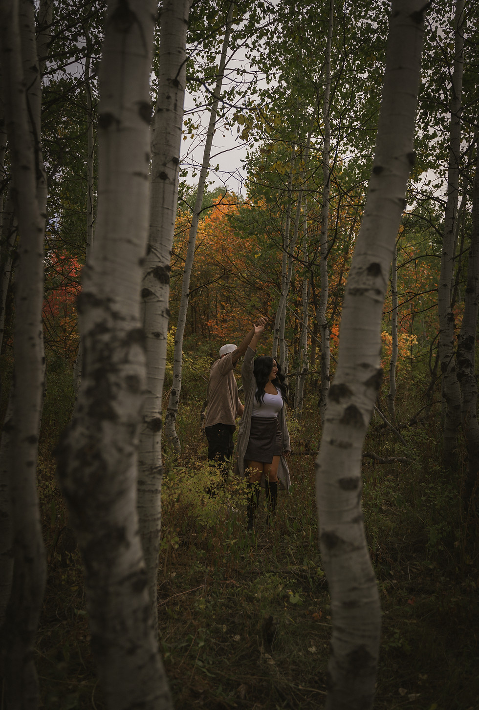 Couple dancing in an autumn forest