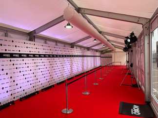 Stylish weatherproof marquee providing a seamless entryway for VIP guests