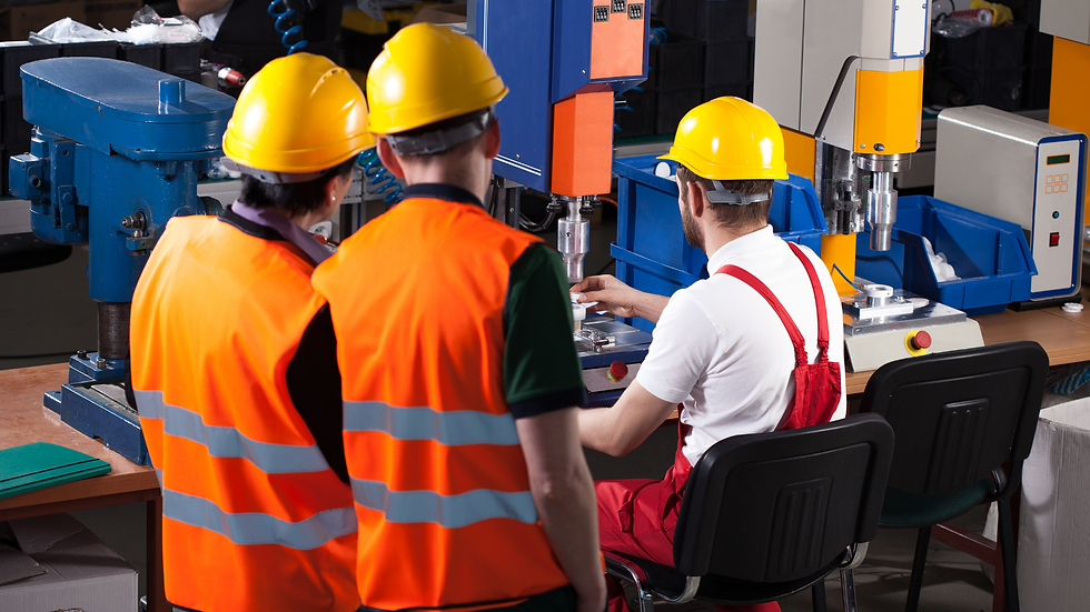 Warehouse workers in safety vests coordinating logistics operations.