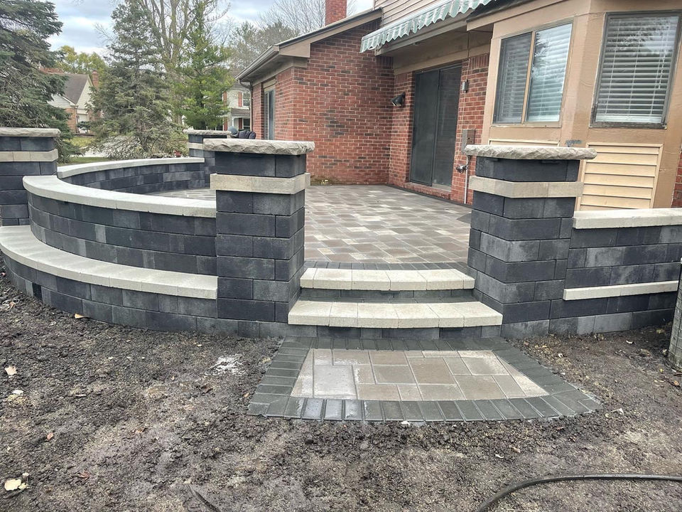 A recently finished circular brick paver patio