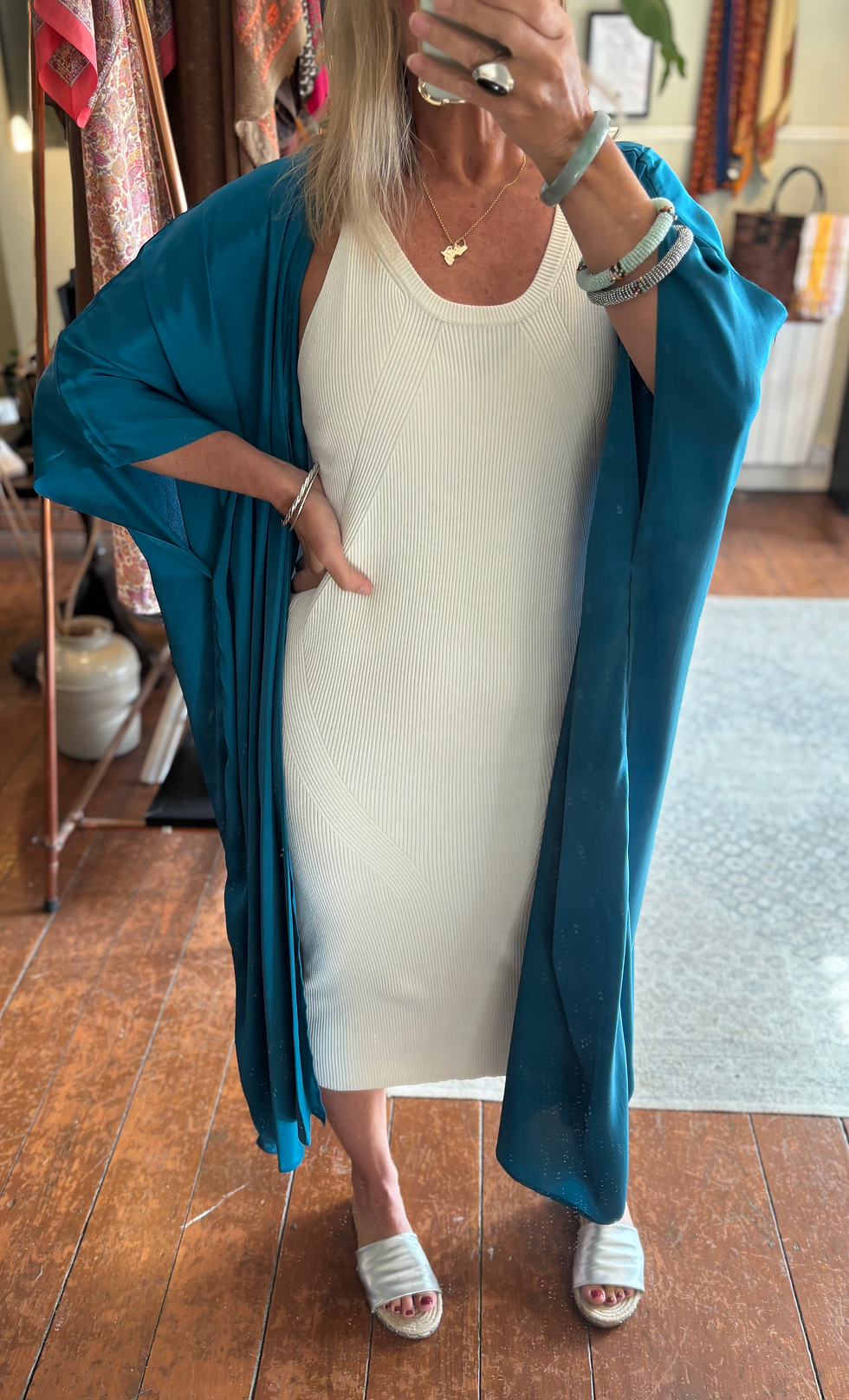 Thumbnail: Plain Teal Silk Kimono with draped sleeve front view on model with white dress
