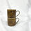 Thumbnail: Stacked Sunstone ceramic handmade espresso cup pair with handle glaze with golden tones and matte finish