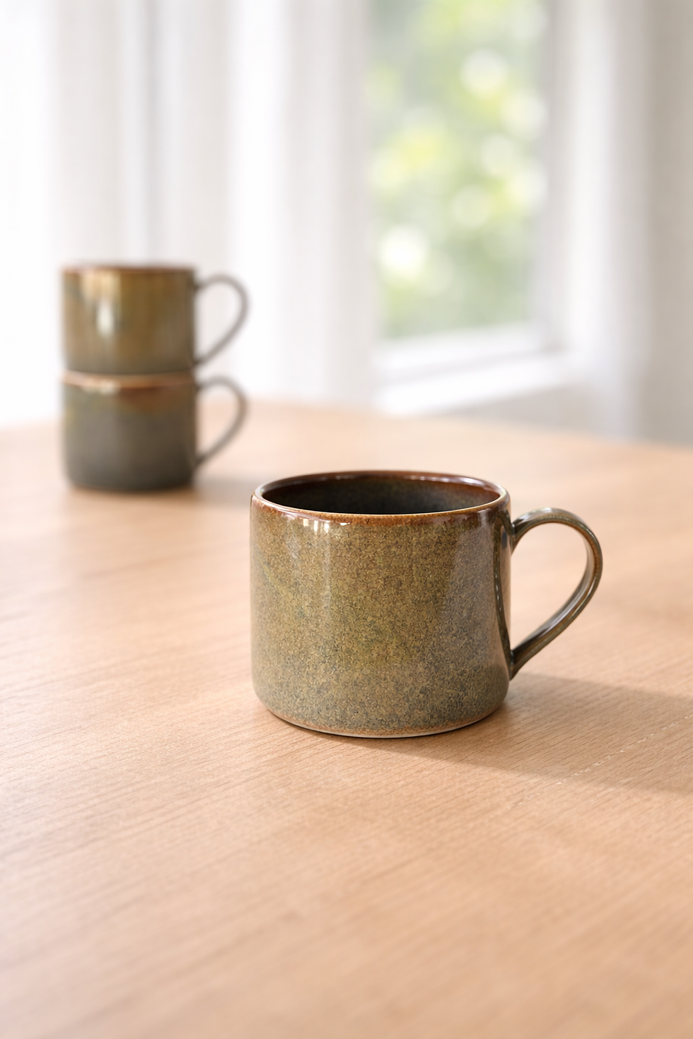up close wheel thrown ceramic solstice mug with changing tones of colour resembling a galaxy