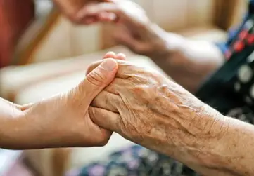 interfaith caregivers volunteer holding hands 
