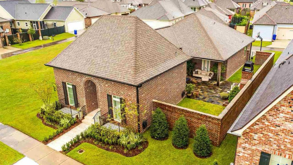 Brick house, landscaped yard, Rue L'Amitie