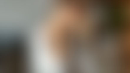 Woman experiencing neck stiffness at desk