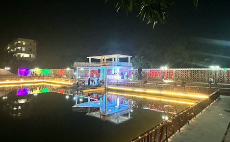 a reflection of a building in a body of water