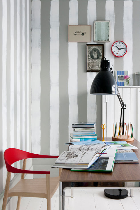 Hand-painted grey and white stripes on the wall of a modern home office desk. Shop for Living Etc. magazine.
