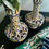 Thumbnail: A pair of hand-painted vases in green, blue and yellow.