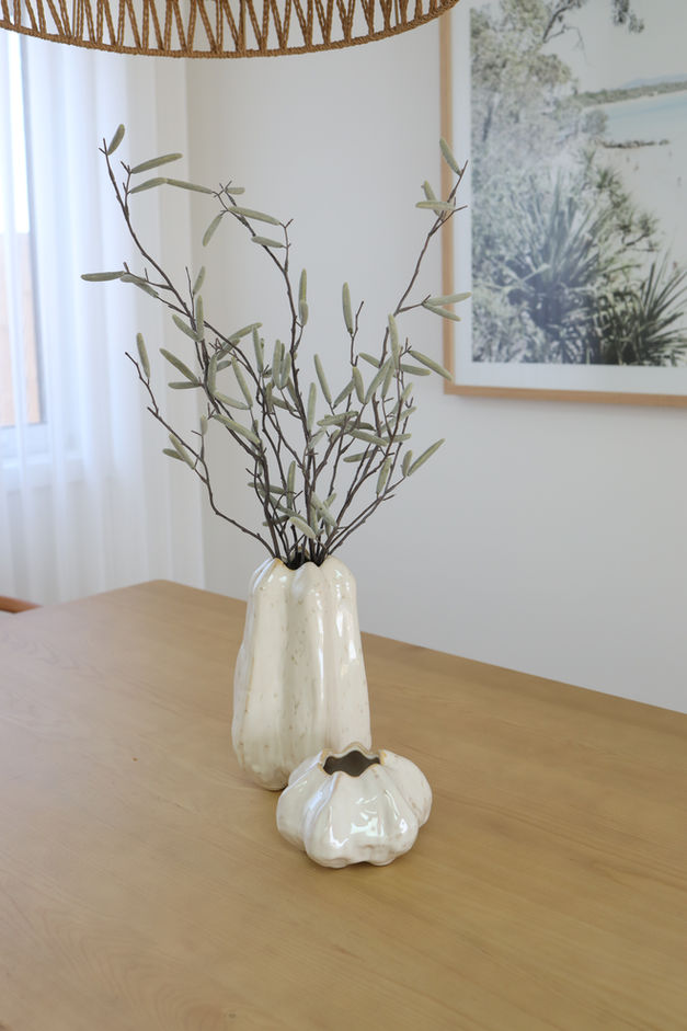 Beautiful vases from Floral Interiors on a timber dining table