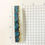 Thumbnail: Medium sized hair clip, off-white with shades of teal and amber pattern