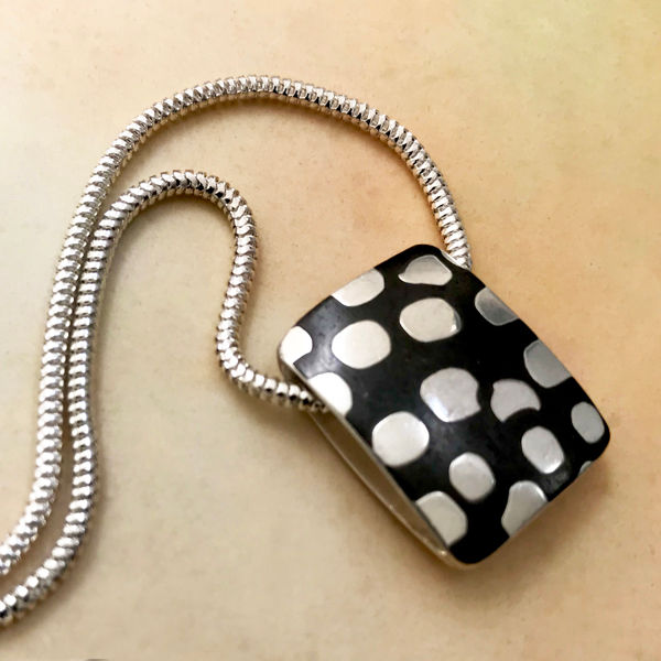 Thumbnail: side view puffy rectangle pendant on silver chain
