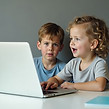 Child practising spelling and writing skills with structured support