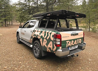 Mitsubishi L200 Tarasso Camper Truck, with closed rooftop tent in the forest