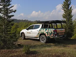 Mitsubishi L200 Tarasso Camper Truck, with closed rooftop tent in the forest