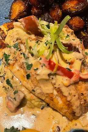 Pelican Grill Orange Beach Red Snapper topped w a Chef made creole cream sauce served w ri