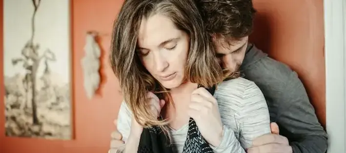 pregnant mom during labor being supported by her partner in a calm enviornment