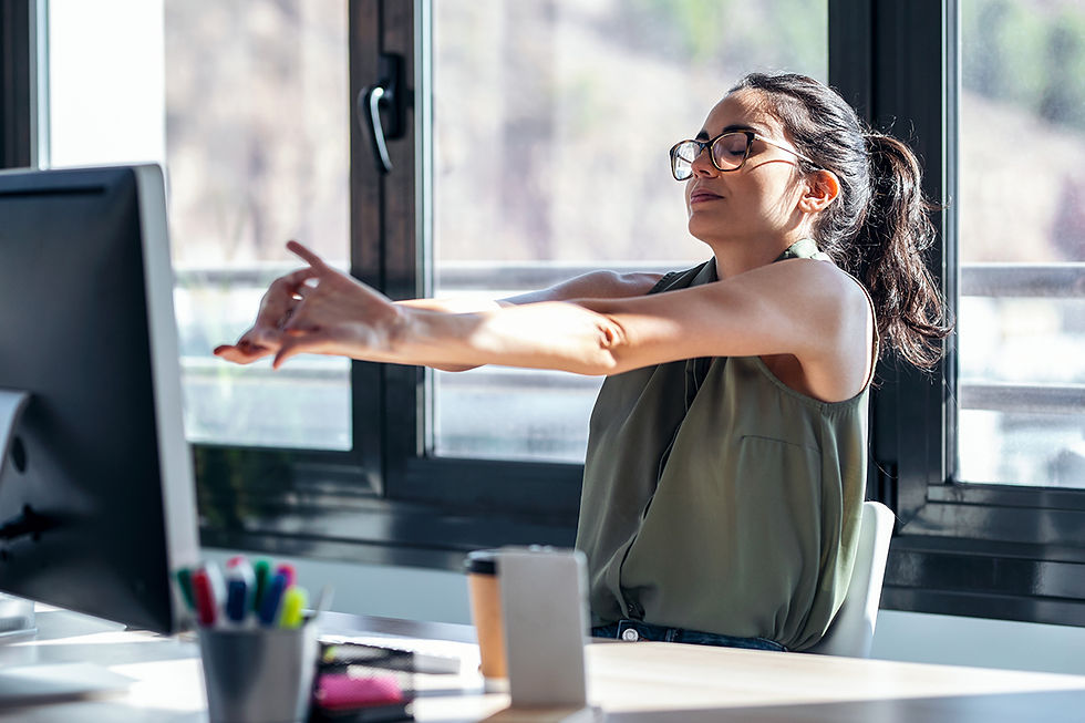 AEC marketer stretching their arms at their desk after hitting send on a proposal submission