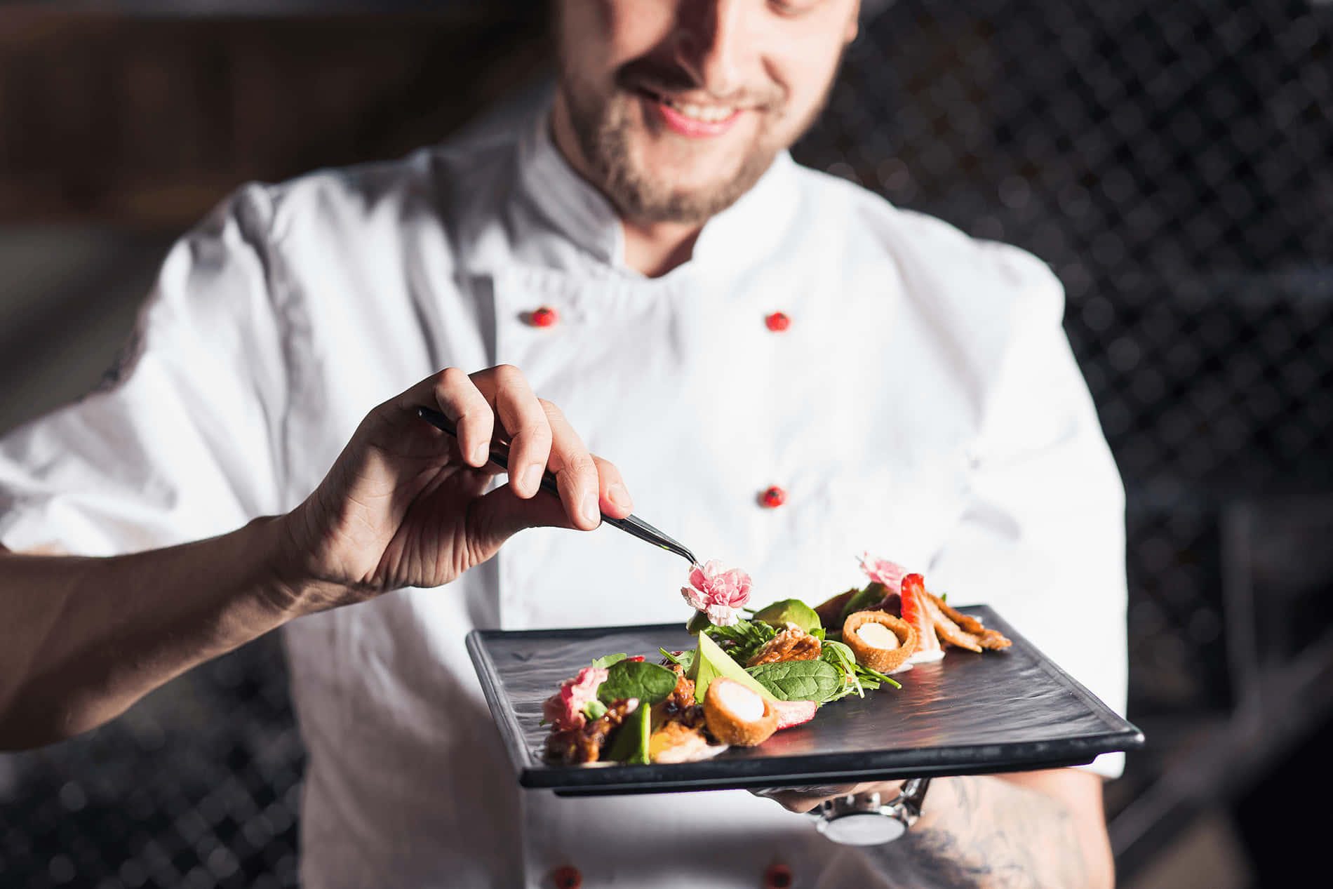 Chef preparing a dish at Toncia