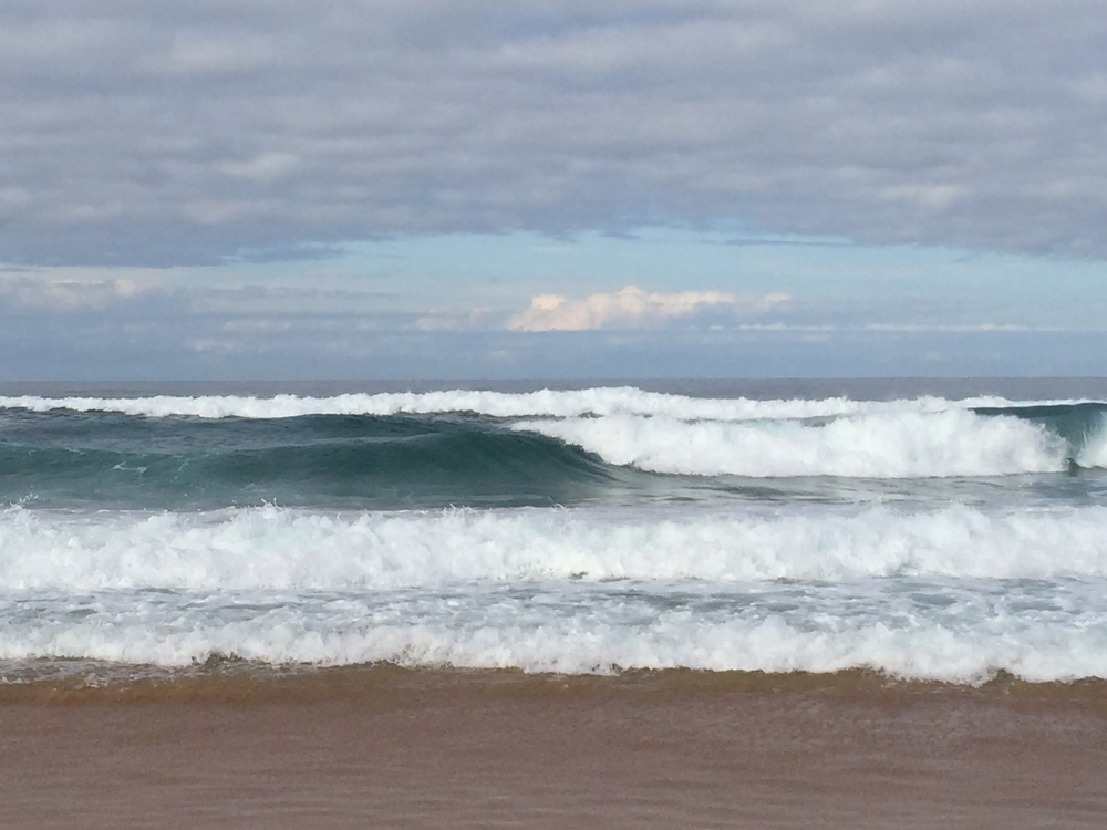 Waves crashing against the shore at Bondi Beach