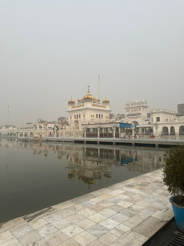 Gurdwara Tarn Taran Sahib with the sarovar or pool in front and an overcast sky