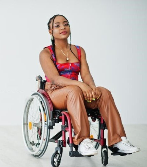 young-disabled-african-american-woman-wheelchair-against-white-wall-215352422_edited.jpg