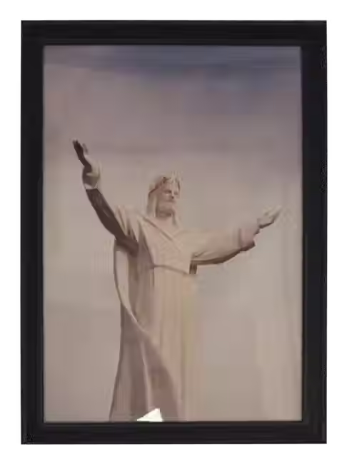 Black and white photograph of a man in motion, captured mid-performance with expressive body language