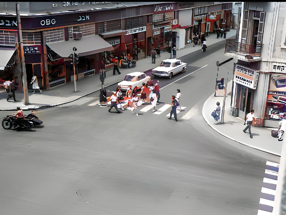 Busy street scene, people crossing, cars waiting