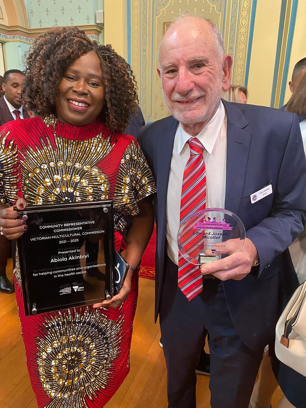 Abiola Akinbiyi with ECCV Chairperson Eddie Micallef at a 2023 VMC Awards presentation.