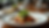 Eye-level view of a beautifully plated gourmet dish at RECREO 2.0