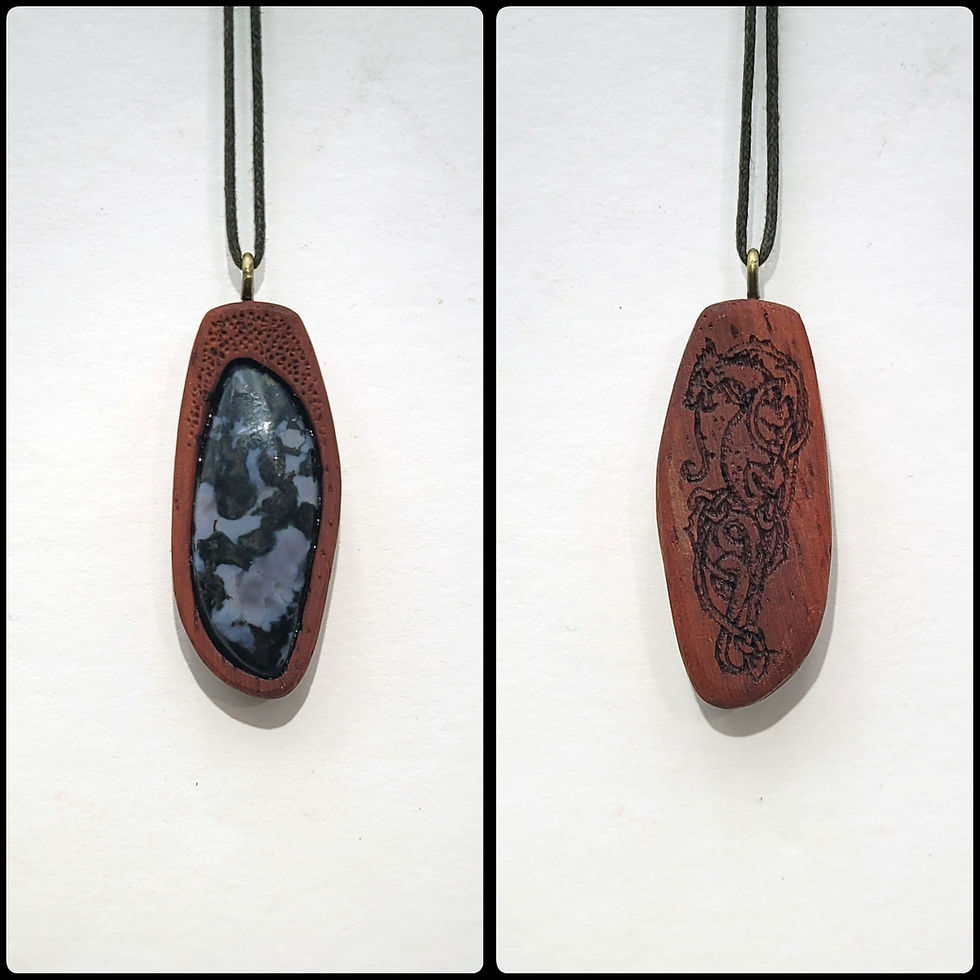 hand carved paduak wood necklace inset with merlinite