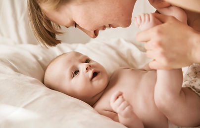 Mother Smiling With Newborn Baby